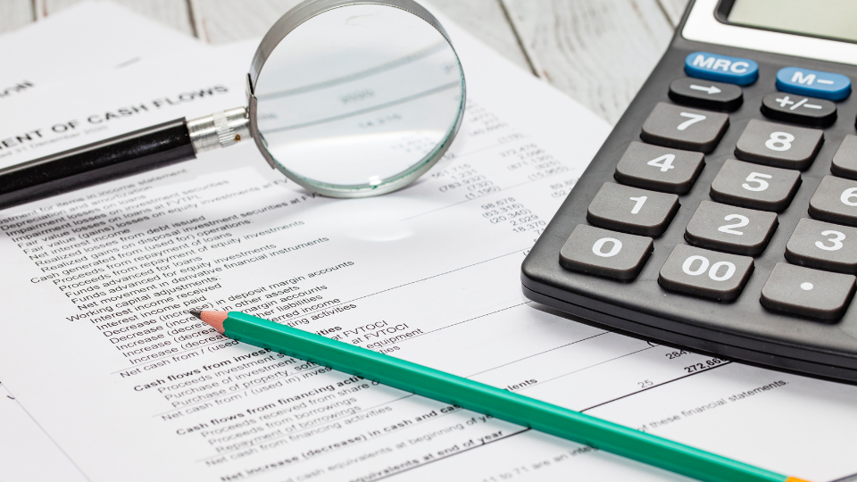 A close up of a cashflow document sitting on a desk.