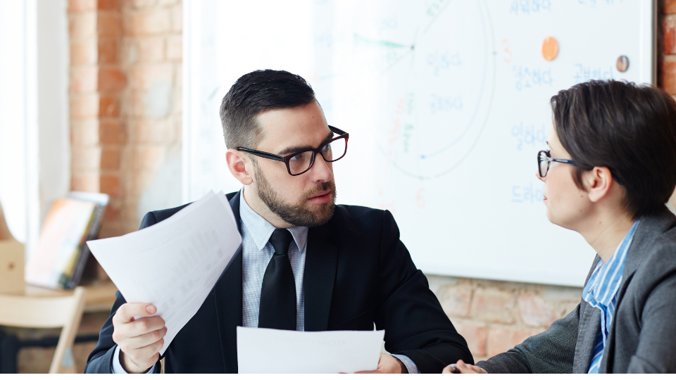 Two concerned lenders discuss loan documents