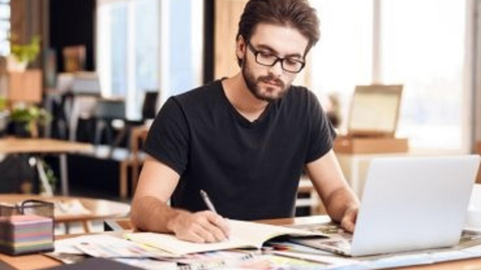 A self-employed individual gathers their proof of income documents for loan approval